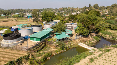 Aerial view of the Surface Water Treatment Plant linked to the nearby unclean water body in Teknaf with the Rohingya Camps in the back. (Mushfiqul Alam/Oxfam)