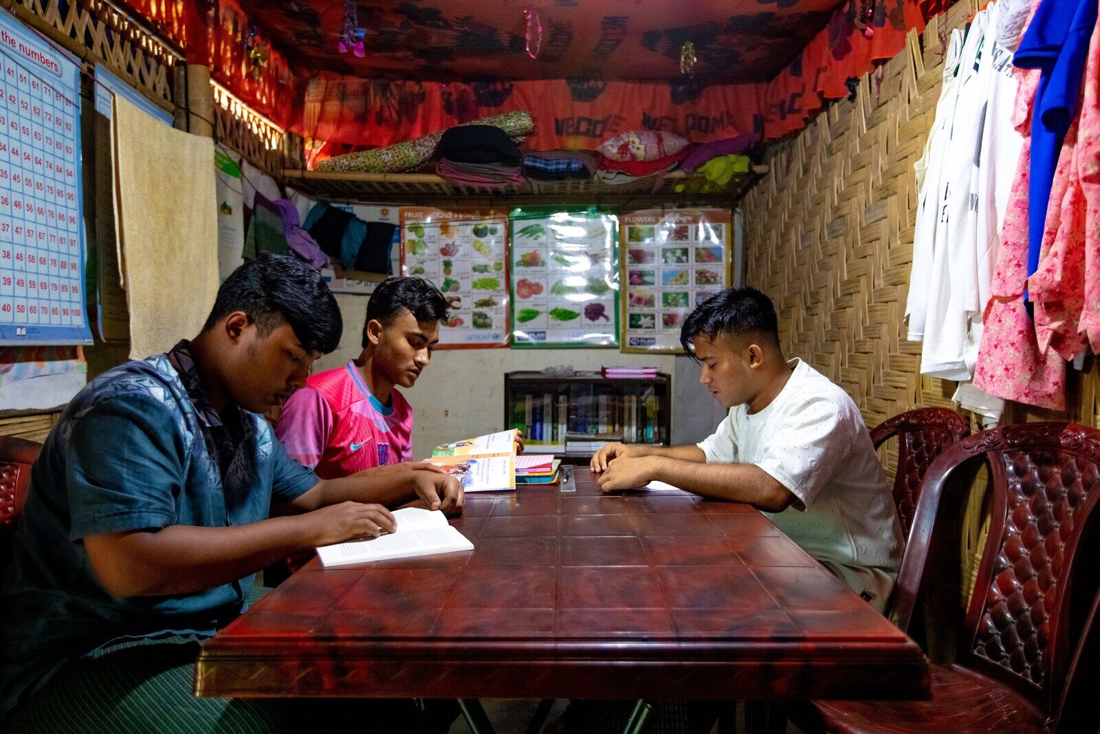 Omar Shahad, Mohammed Jamil and Mohammed Arfat study together in the community library. (Jubair Bin Iqbal/Oxfam)