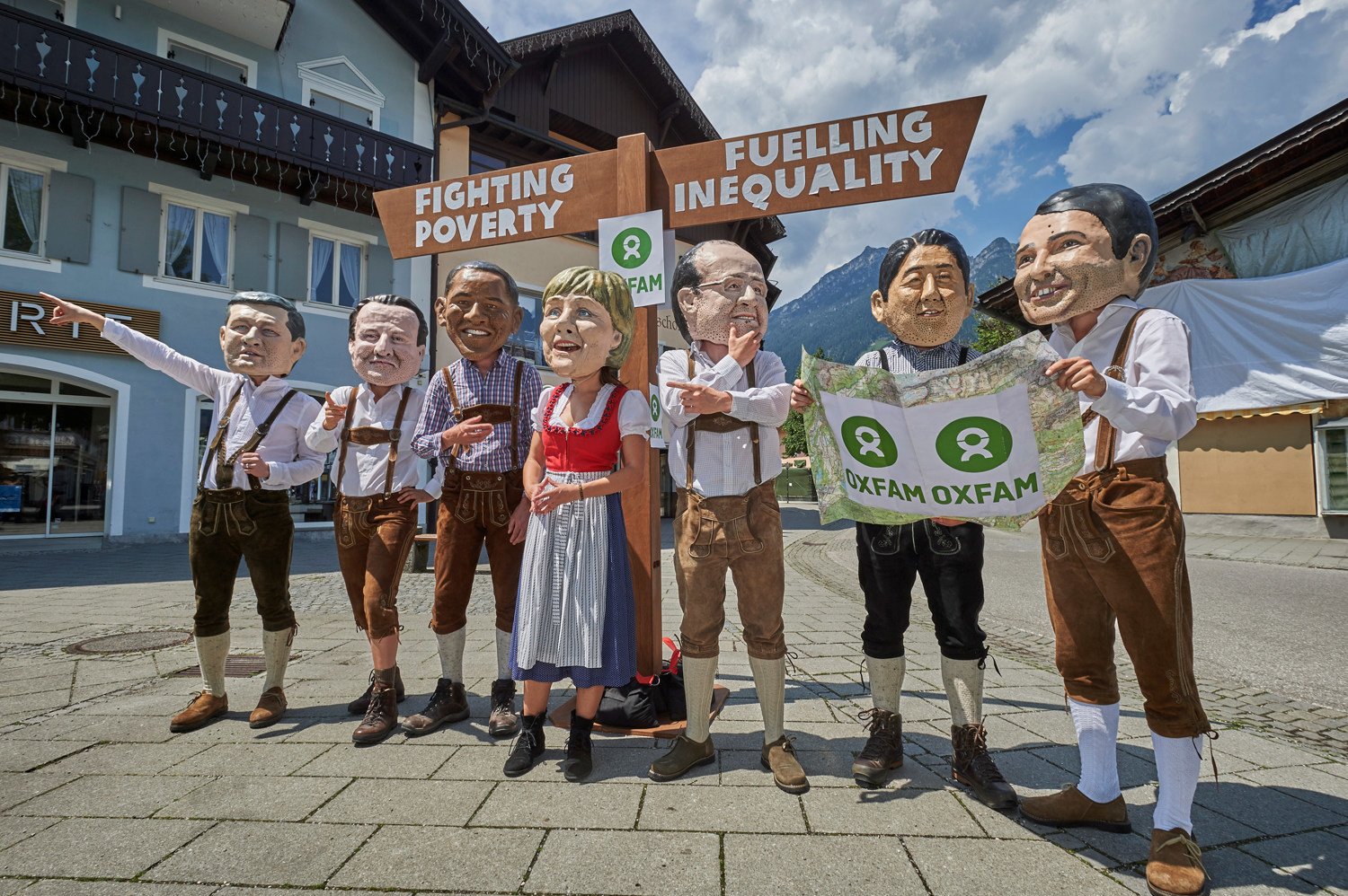 G7 leaders depicted with huge heads and kitted out with walking boots and maps must get on the right path to overcome poverty and inequality.