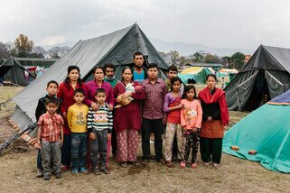 Forty-five-day-old Hari and his family survived the deadly earthquake and are taking shelter in an open-air camp, but they still face many challenges. Oxfam is currently installing hygiene facilities in these camps. (Photo: Aubrey Wade / Oxfam)