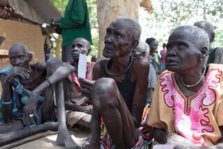 A group of elderly women listen to instructions about a food distribution and the possible assistance coming their way in the next few days. Given their age and poor health, family members helped carry them to the registration site. (Photo: Bruno Bierrenbach Feder/Oxfam)