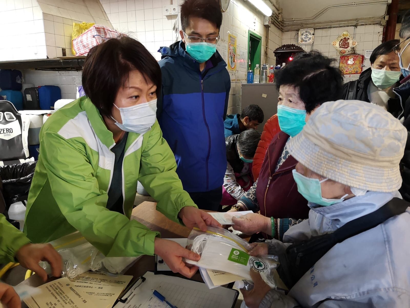 Oxfam Hong Kong staff distributed masks to cleaners at the Java Road Refuse Collection Point during their break.