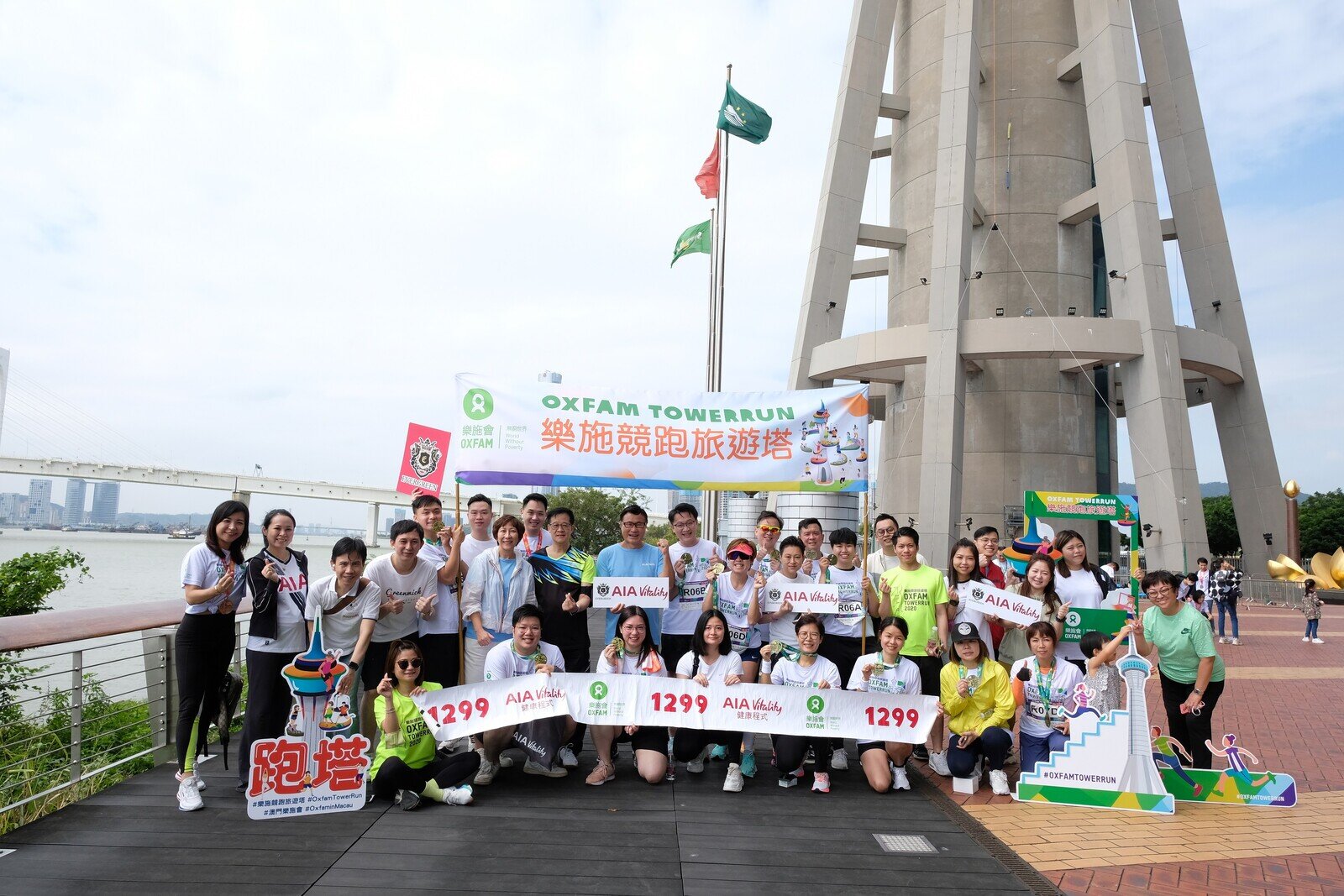 A group standing standing in front of the Macau Tower