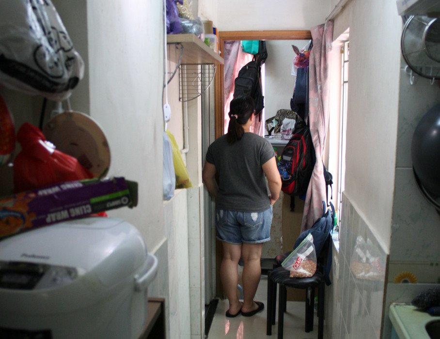 Yin, her husband and their 11-year-old son live in a subdivided flat.