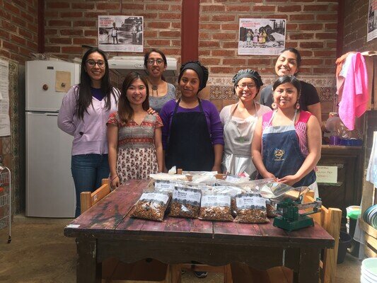 Oxfam Hong Kong staff with the women who produced the granola.